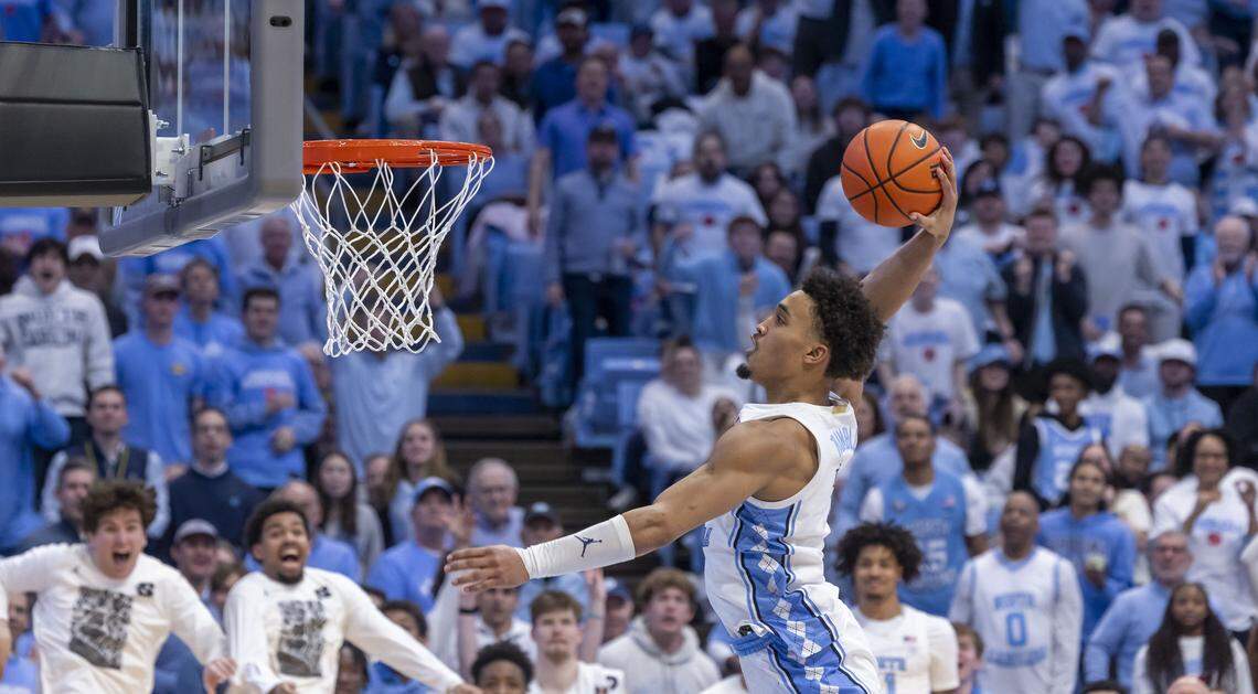 North Carolina guard Seth Trimble (7) soars to the rim for a break away dunk in the second half against Louisville on Monday, February 23, 2026 at the Smith Center in Chapel Hill, N.C. Trimble lead all scores with 30 points, a career high, in the Tar Heels’ 77-74 victory.