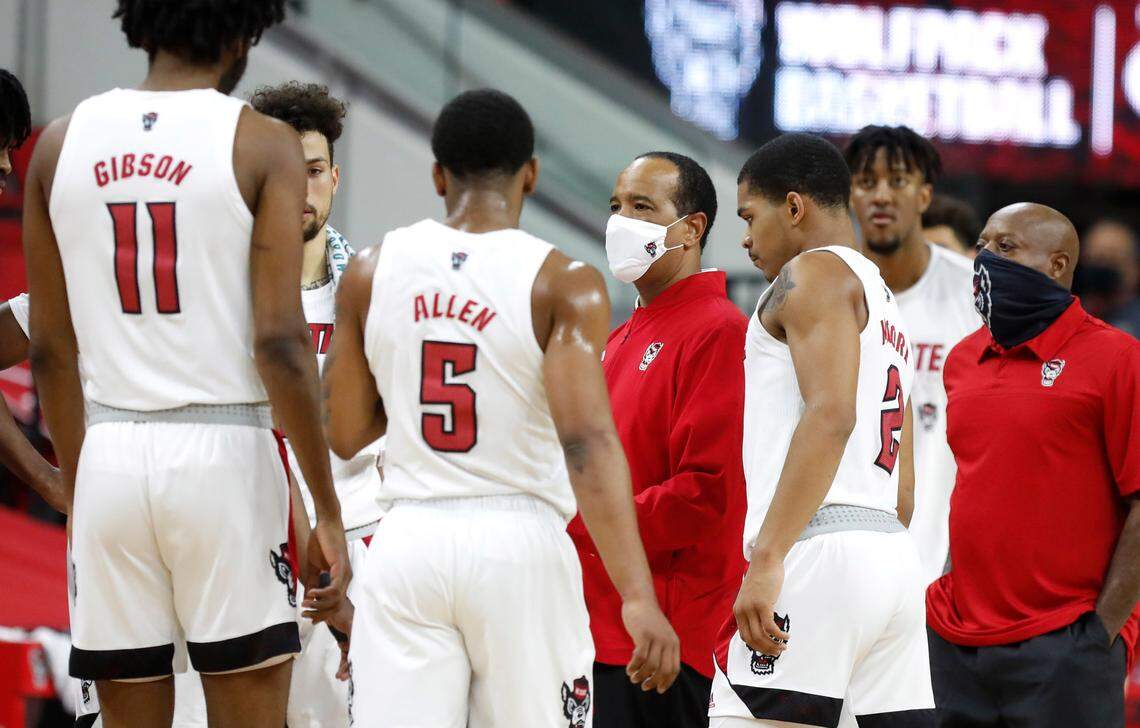 N.C. State head coach Kevin Keatts talks with his team during the first half of N.C. State’s game against Miami at PNC Arena in Raleigh, N.C., Saturday, January 9, 2021.