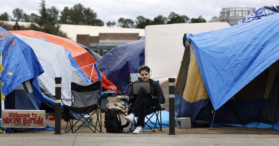 Duke junior Clarke Campbell studies in Krzyzewskiville at Duke University in Durham, N.C., Wednesday, Feb. 18, 2026. It is the 40th anniversary of the annual tent city for tickets for the Blue Devils’ game against North Carolina.