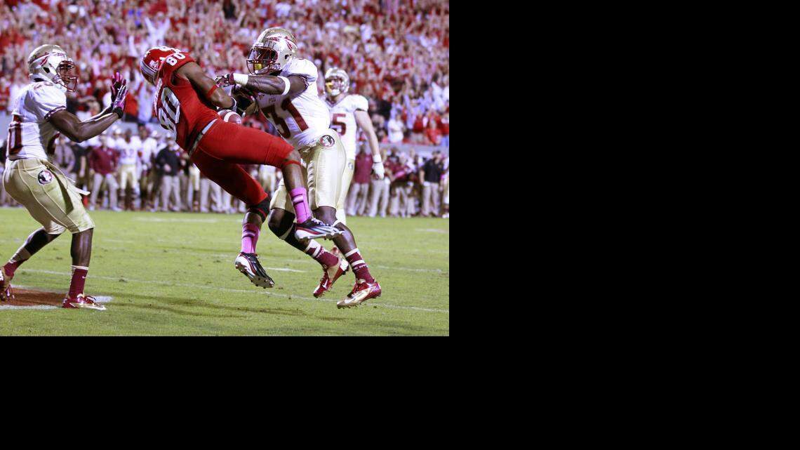 N.C. State wide receiver Bryan Underwood catches the winning touchdown as Florida State defensive back Terrence Brooks (31) defends during the Wolfpack's 17-16 victory at Carter-Finley Stadium on Saturday, October 6, 2012.
