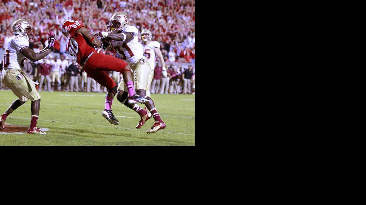 N.C. State wide receiver Bryan Underwood catches the winning touchdown as Florida State defensive back Terrence Brooks (31) defends during the Wolfpack's 17-16 victory at Carter-Finley Stadium on Saturday, October 6, 2012.
