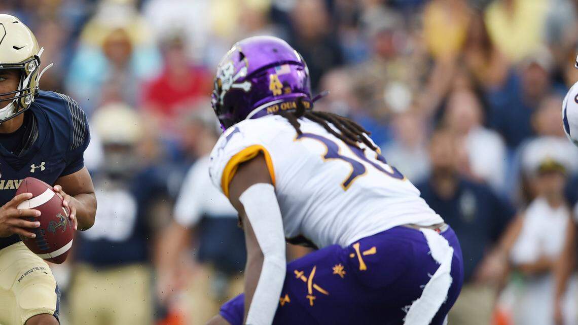 Navy quarterback Malcolm Perry runs the ball against East Carolina during an NCAA football game on Saturday, Sept. 14, 2019 in Baltimore. (AP Photo/Gail Burton)