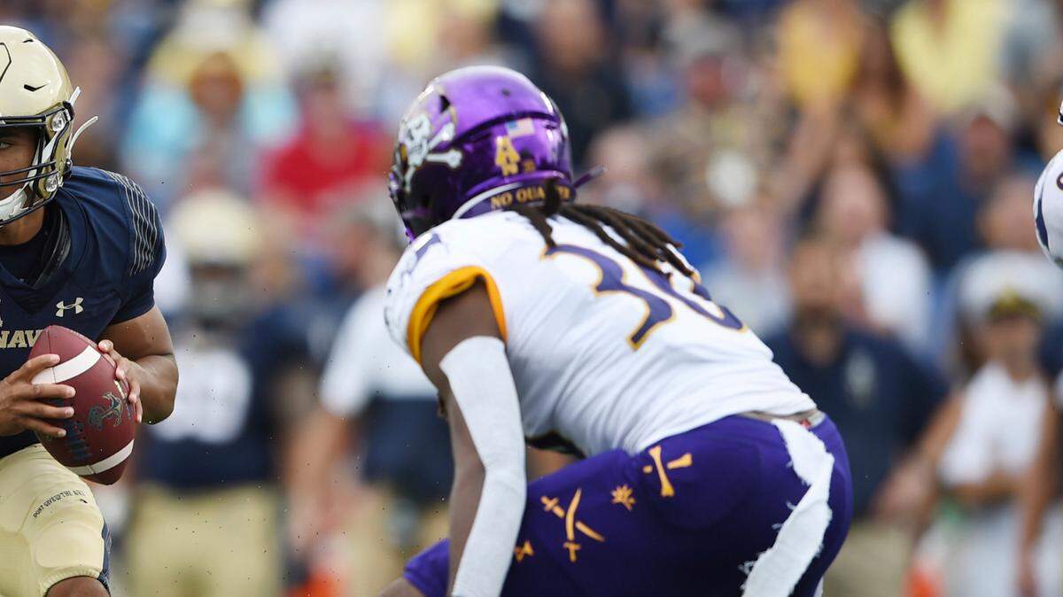 Navy quarterback Malcolm Perry runs the ball against East Carolina during an NCAA football game on Saturday, Sept. 14, 2019 in Baltimore. (AP Photo/Gail Burton)