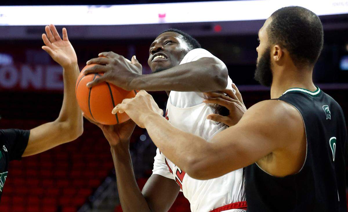 N.C. State’s Mohamed Diarra (23) looks towards the basket as Mount Olive’s Aaron Murphy (2) defends during the second half of N.C. State’s 89-76 exhibition victory over Mount Olive at PNC Arena in Raleigh, N.C., Wednesday, Nov. 1, 2023.