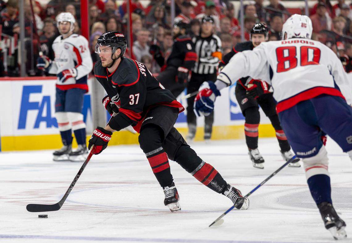 Carolina Hurricanes right wing Andrei Svechnikov (37) moves the puck against against the Washington Capitals left wing Pierre-Luc Dubois (80) in the first period during Game 4 of their series on Monday, May 12, 2025 at Lenovo Center in Raleigh, N.C.