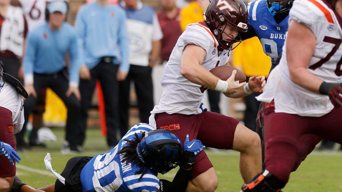 Duke Blue Devils defensive back Brandon Johnson sacks Virginia Tech Hokies quarterback Grant Wells during the second half of a football game at Wallace Wade Stadium on Saturday, Nov. 12, 2022, in Durham, N.C.
