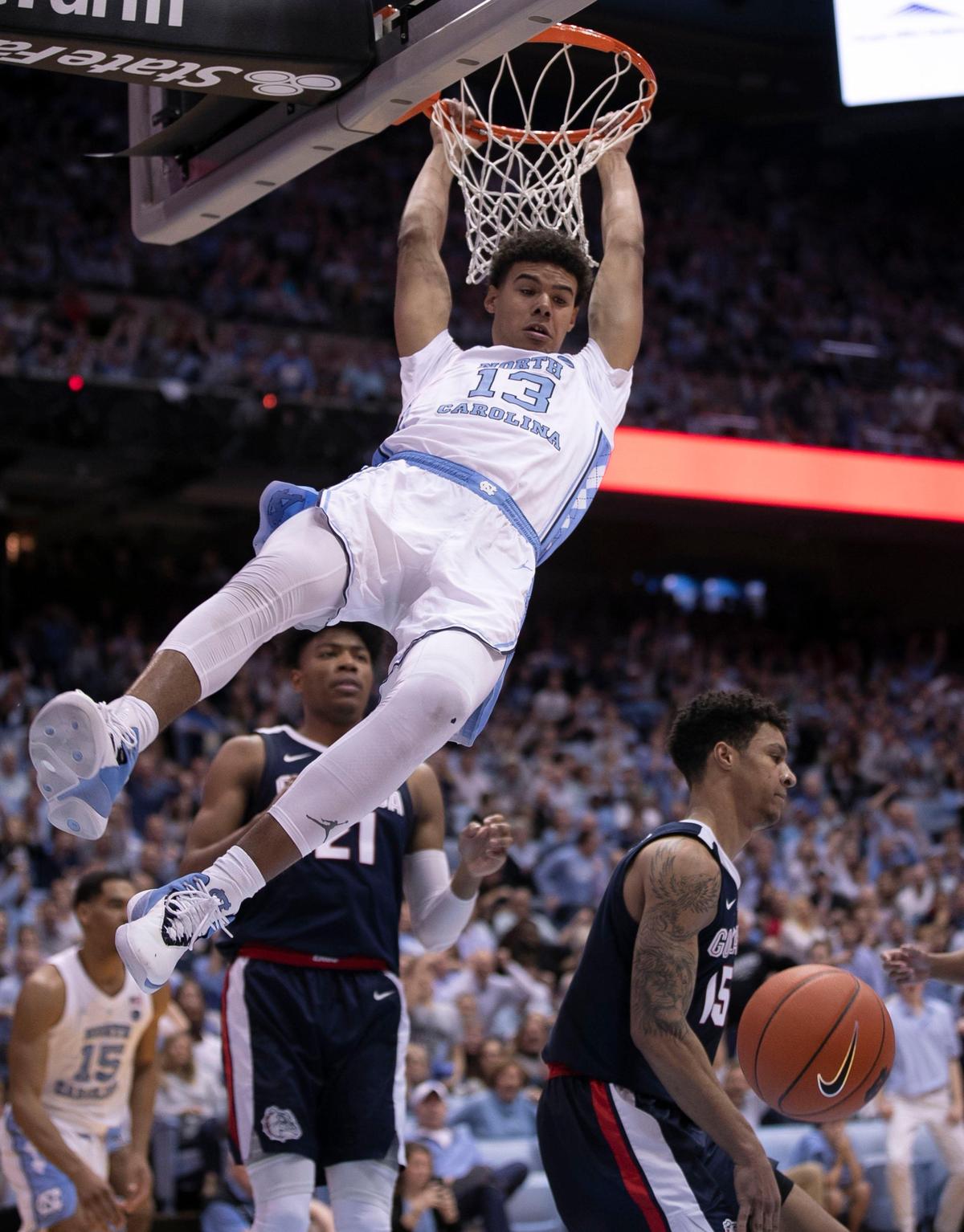 North Carolina’s Cameron Johnson (13) gets a dunk against Gonzaga’s RBrandon Clarke (15) during the first half on Saturday, December 15, 2018 at the Smith Center in Chapel Hill, N.C.