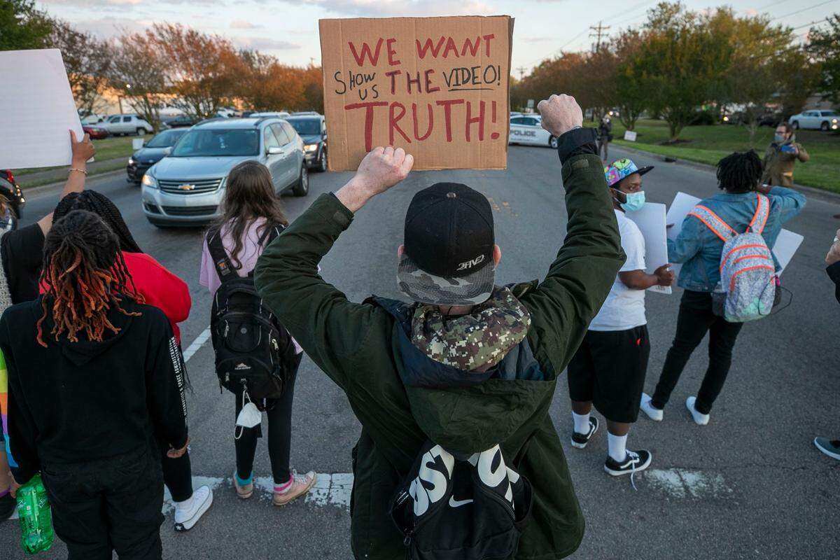Protesters block the intersection of Ehringhaus Street and Halstead Blvd. during a demonstration and march on Thursday, April 22, 2021in Elizabeth City, NC, in reaction to the death of Andrew Brown Jr., who was shot by a Pasquotank County Deputy Sheriff on Wednesday. The march drew nearly 300 participants and lasted about three hours.