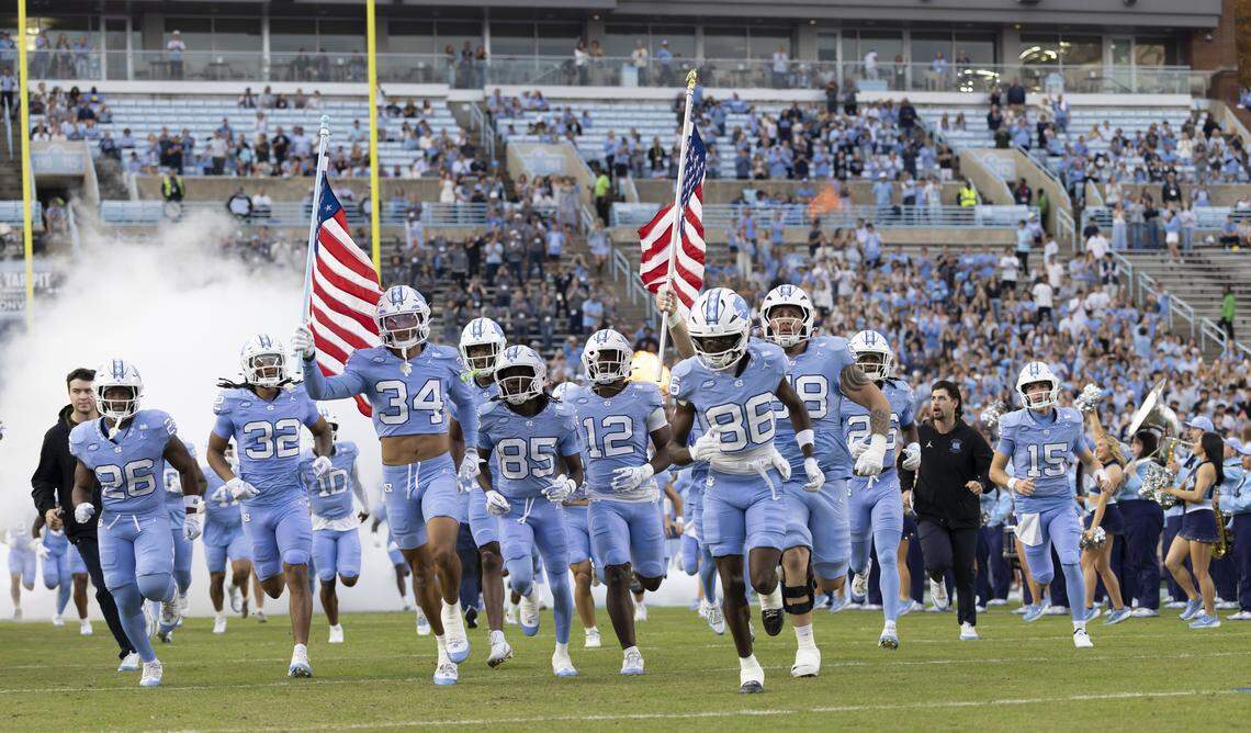 North Carolina defensive back Malcolm Ziglar (34) leads his teammates into Kenan Stadium for their game against Stanford on Saturday, November 8, 2025 at Kenan Stadium in Chapel Hill, N.C.