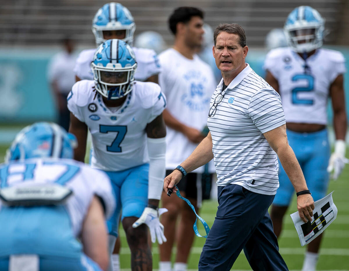 North Carolina assistant head coach for defense Gene Chizik works with his players prior to the Tar Heels’ spring football game on Saturday, April 15, 2023 at Kenan Stadium in Chapel Hill, N.C.