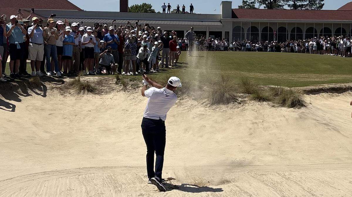 Bryson DeChambeau recreates his U.S. Open-winning bunker shot Monday on the 18th hole of Pinehurst’s No. 2 course. Pinehurst and the USGA unveiled a plaque honoring DeChambeau’s shot during last June’s U.S. Open