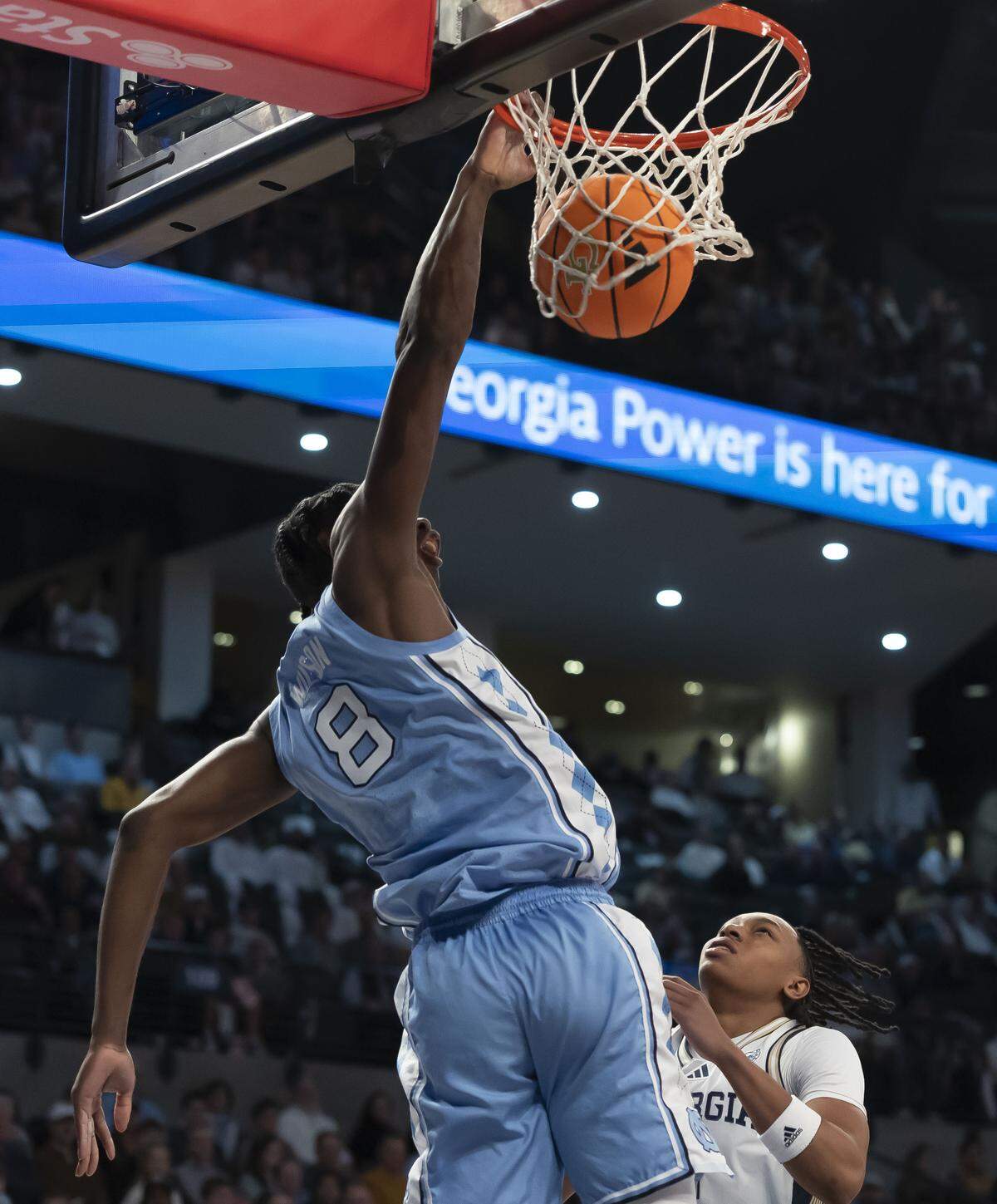 North Carolina forward Caleb Wilson (8) finishes a lob pass from guard Kyan Evans with a one-handed dunk over Georgia Tech guard Akai Fleming (0) in the first half on Saturday, January 31, 2026 at McCamish Pavillon in Atlanta Ga.