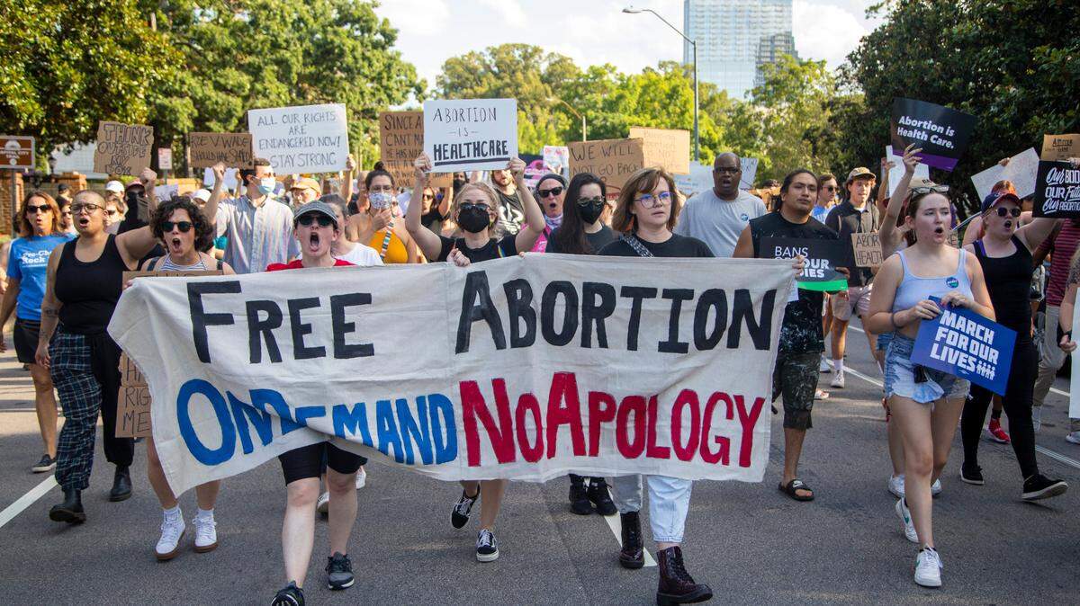 Hundreds of demonstrators rally and march in downtown Raleigh Friday, June, 24, 2022 in opposition to the U.S. Supreme Court’s decision to overturn its landmark Roe v. Wade ruling.