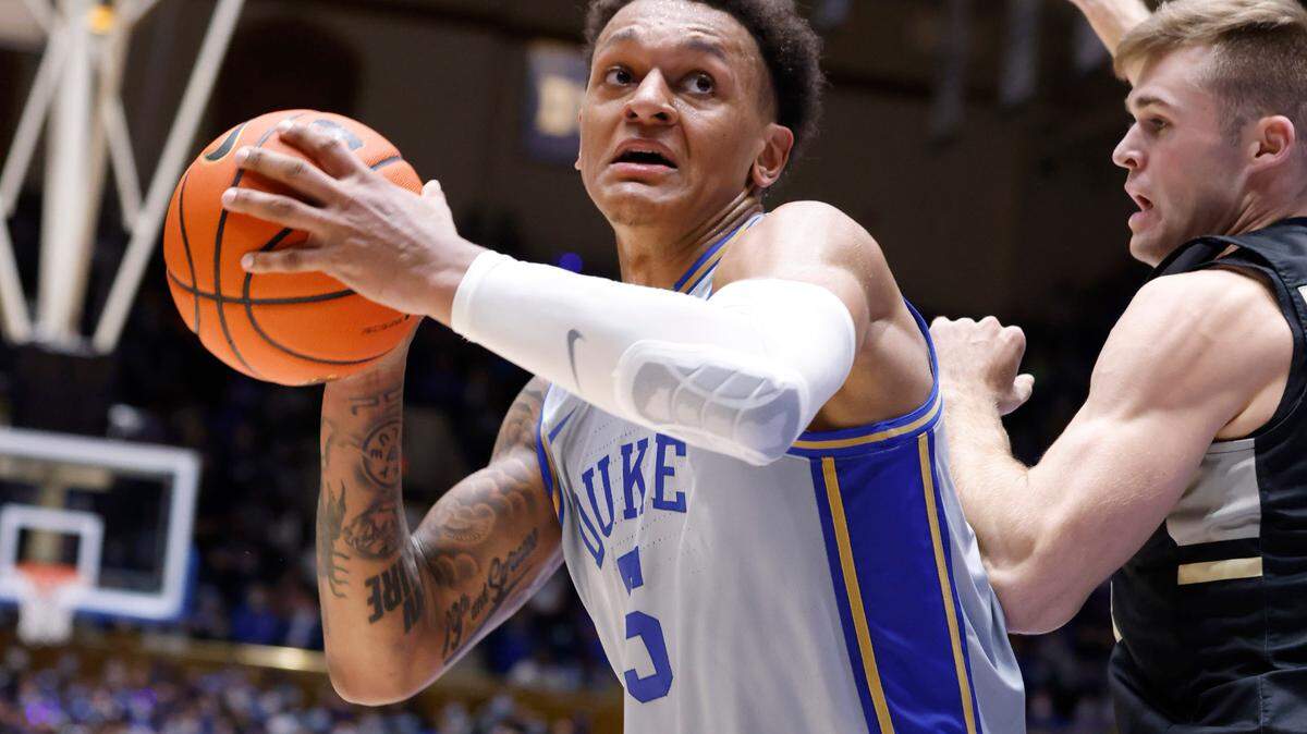 Duke’s Paolo Banchero (5) gets around Army’s Matt Dove (44) during the first half of Duke’s game against Army at Cameron Indoor Stadium in Durham, N.C., Friday, November 12, 2021.