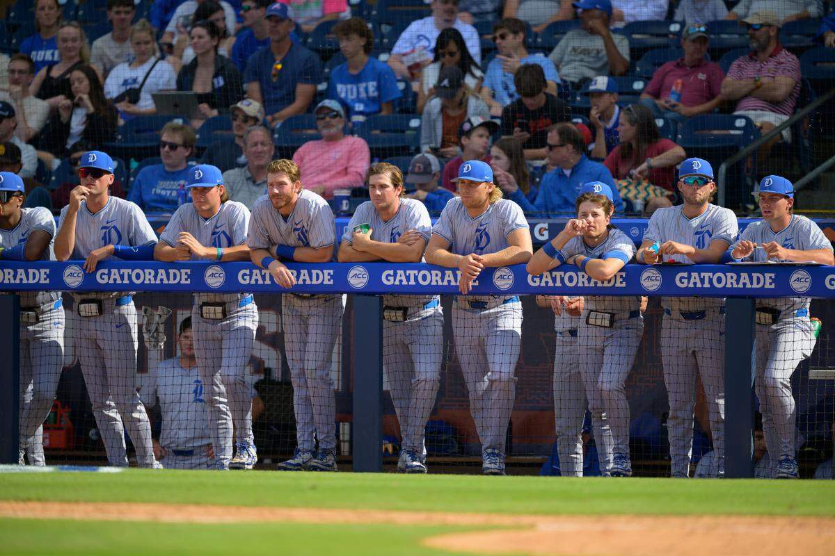 Duke players watch from the dugout during the Blue Devils 14-7 loss during the ACC Tournament quarterfinals on Friday, May 23, 2025, at Durham Bulls Athletic Park in Durham, N.C.