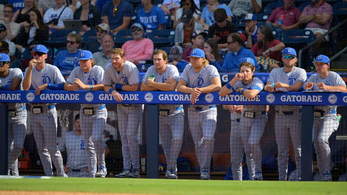 Duke players watch from the dugout during the Blue Devils 14-7 loss during the ACC Tournament quarterfinals on Friday, May 23, 2025, at Durham Bulls Athletic Park in Durham, N.C.