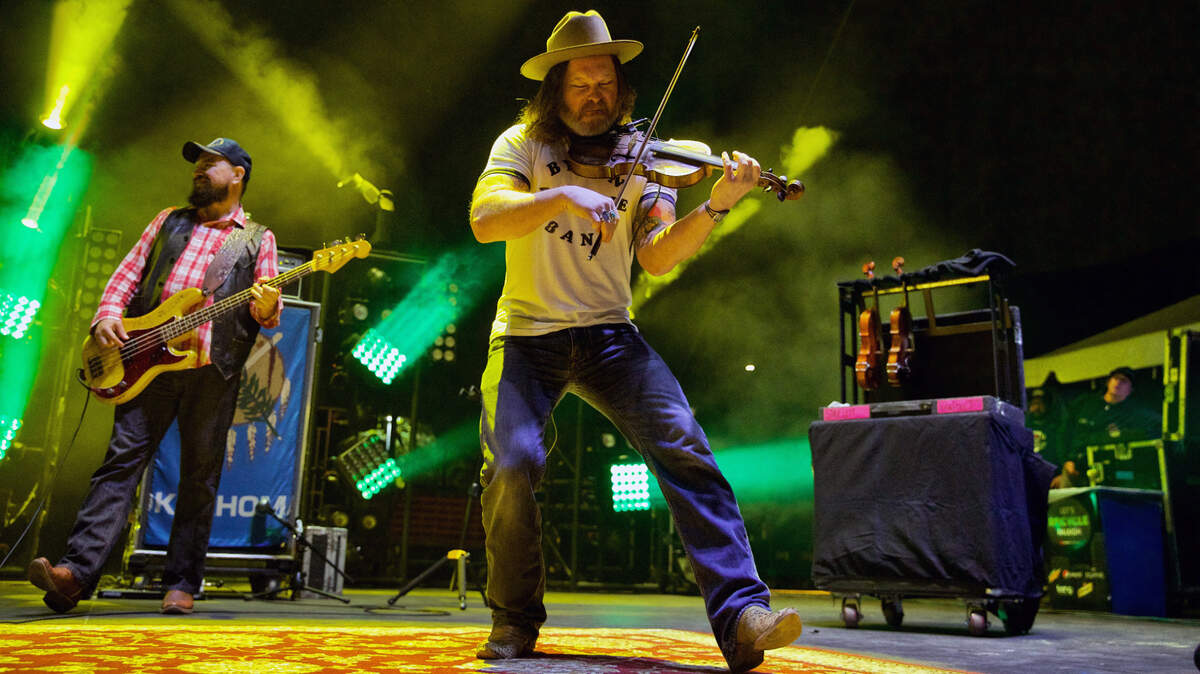 Turnpike Troubadours fiddle player Kyle Nix and bassist R.C. Edwards on stage at the Band Together Mighty Giveback concert, Friday night, Oct. 28, 2022.