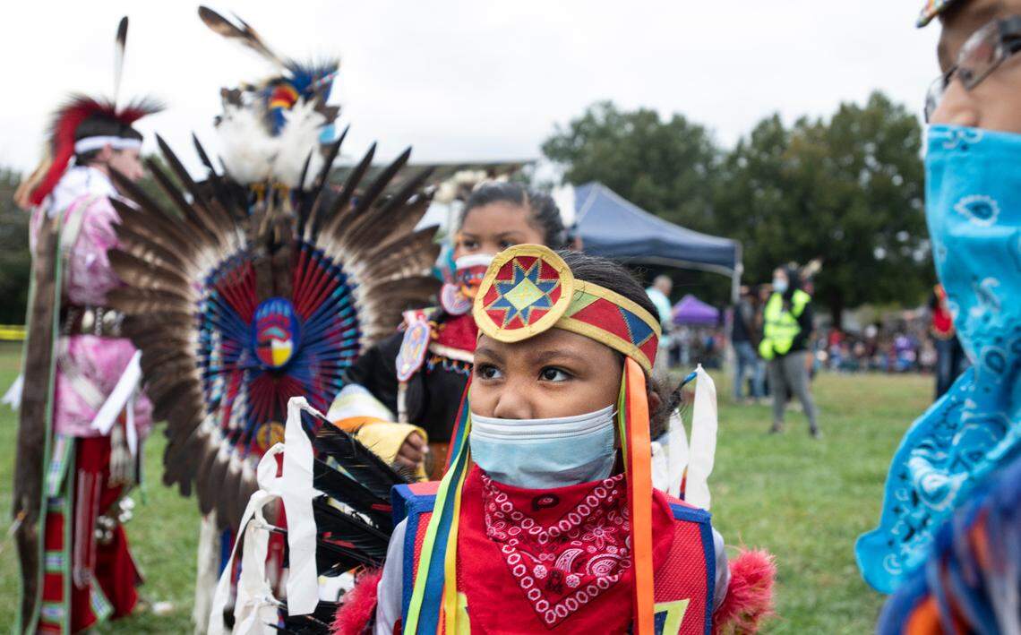 Young dancers wait to participate in the grand entry at the Inter-tribal Pow Wow celebrating the legacy and culture of North Carolina Indigenous communities Saturday, Oct. 23, 2021 at Raleigh’s Dix Park.