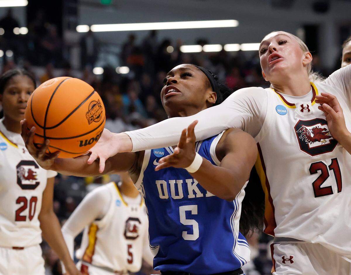 Duke’s Oluchi Okananwa and South Carolina’s Chloe Kitts battle for a rebound during the first half of the Blue Devils’ NCAA Tournament Elite Eight matchup at Legacy Arena on Sunday, March 30, 2025, in Birmingham, Ala.