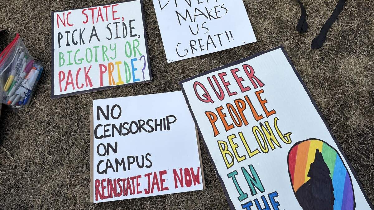 Student-made signs for a rally to reinstate former NC State Pride Center assistant director Jae Edwards at Talley Student Union on March 11.