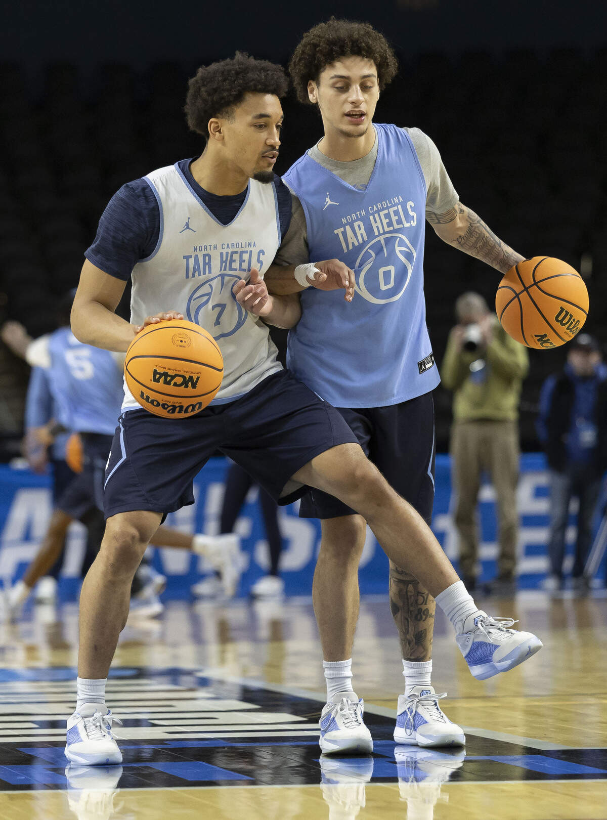 North Carolina guards Seth Trimble (7) and Kyan Evans (0) workout with teammates as they prepare for their first round NCAA game against VCU, on Wednesday, March 18, 2026 in Greenville, S.C.