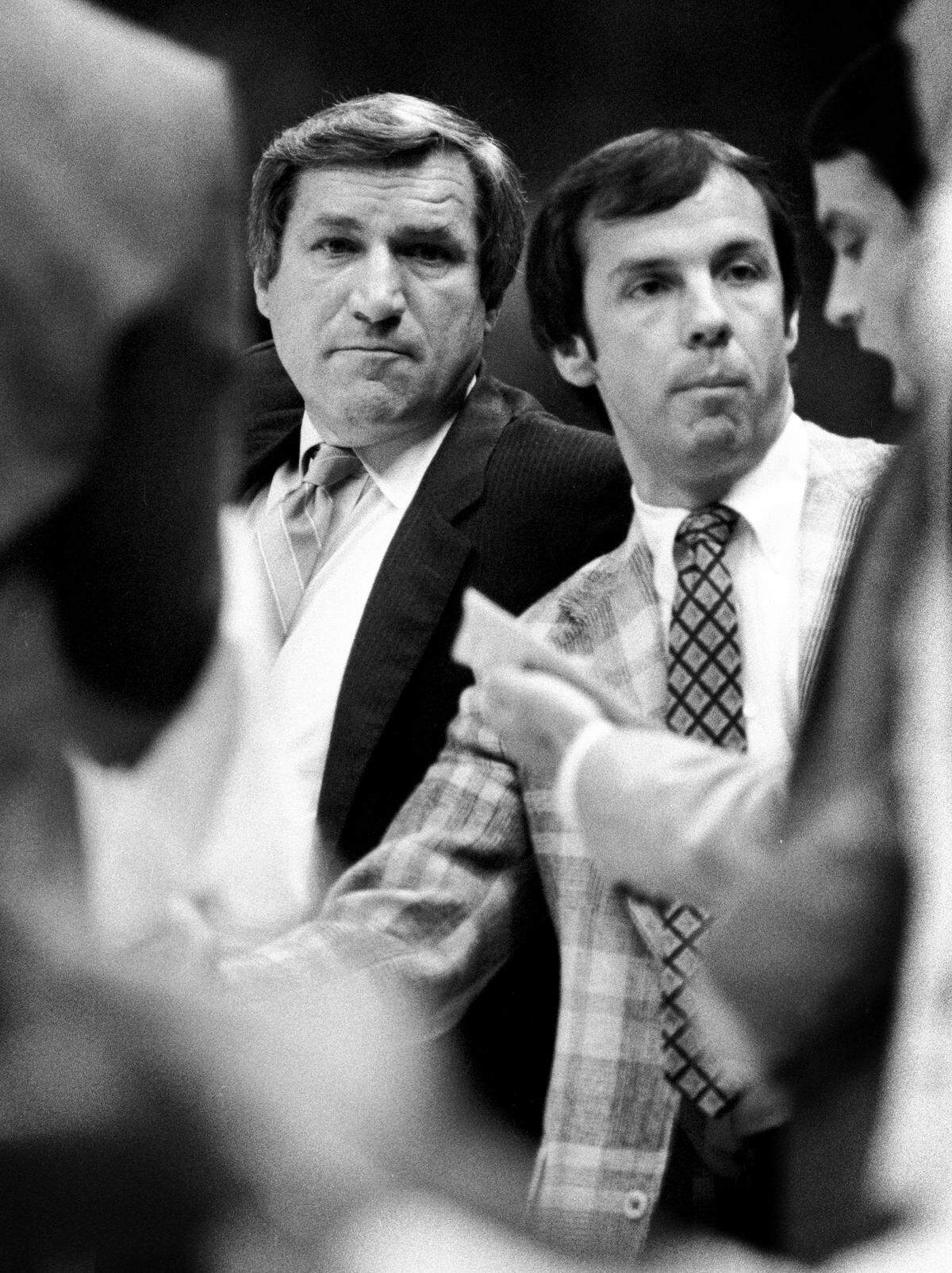 UNC coach Dean Smith with a young assistant coach Roy Williams during a 1979 game in Carmaichel Auditorium in Chapel Hill, NC.
