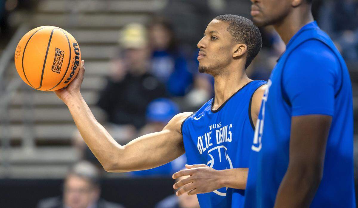 Duke walk-on Brock Davis (50) passes the ball to a teammate during the Blue Devils’ practice on Wednesday, March 18, 2026, at Bon Secours Arena in Greenville, S.C.  Davis joined the team last week during the ACC Tournament, after starters Patrick Ngongba II and Caleb Foster (1) suffered injuries. 