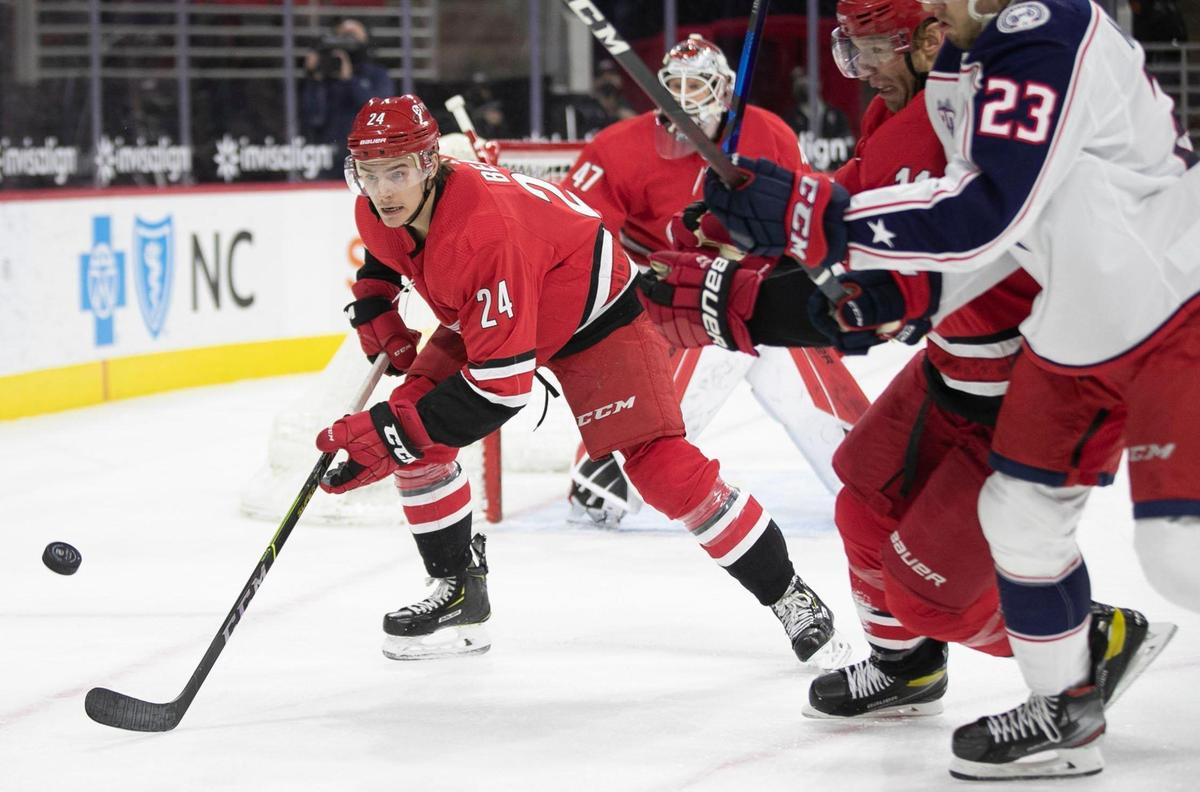 Carolina Hurricanes’ Jake Bean (24) chases down the puck during the first period against Columbus on Saturday, March 20, 2021 at PNC Arena in Raleigh, N.C.