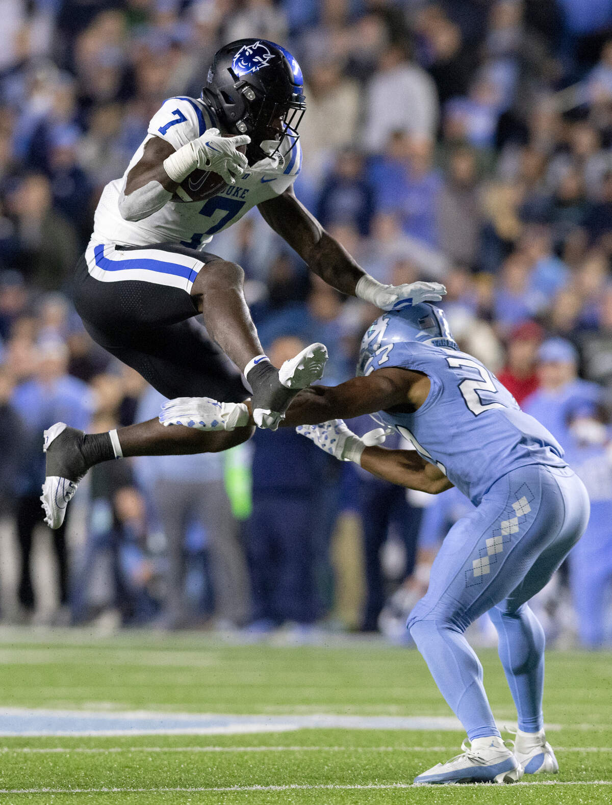 Duke’s Jordan Waters hurdles over North Carolina’s Giovanni Biggers during the second half of the Blue Devils’ 47-45 loss on Saturday, Nov. 11, 2023, at Kenan Stadium in Chapel Hill, N.C.