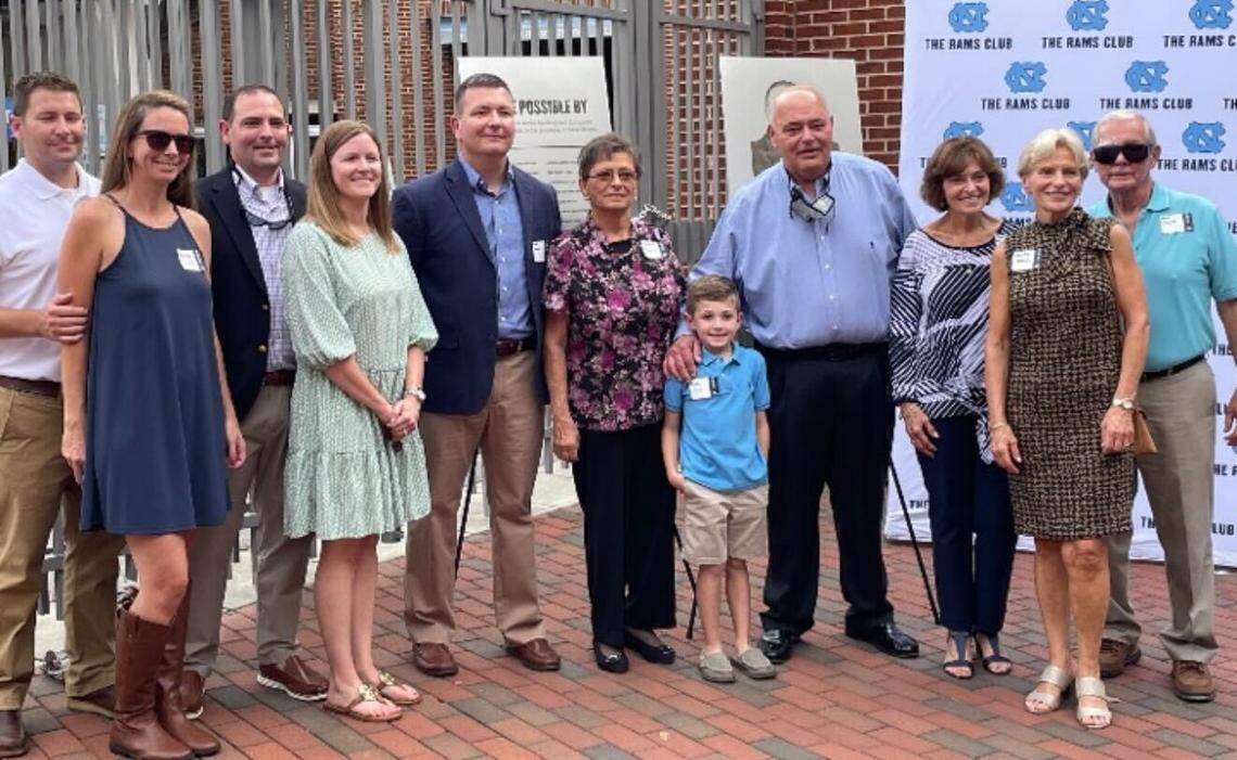 Longtime director of UNC’s Kenan Stadium James Spurling (fourth from right) with his family attending a dedication at the stadium.