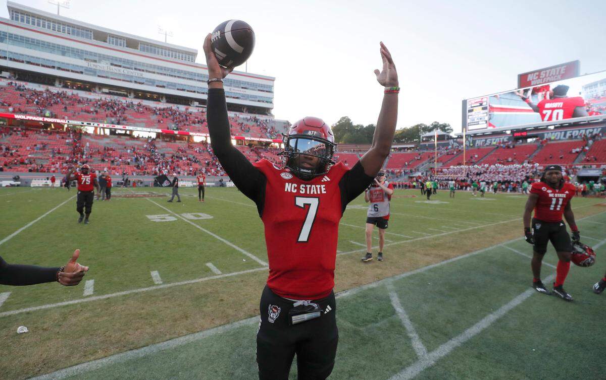 N.C. State quarterback MJ Morris (7) acknowledges the crowd after N.C. State’s 48-41 victory over Marshall at Carter-Finley Stadium in Raleigh, N.C., Saturday, Oct. 7, 2023.