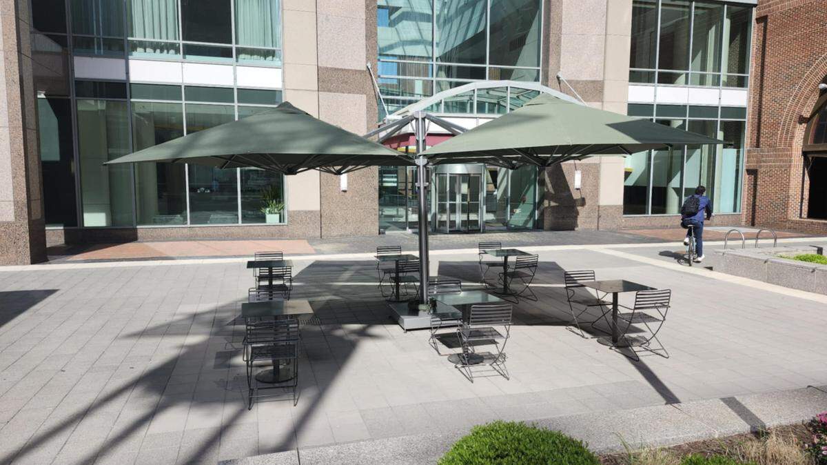 The city of Raleigh installed 13 large umbrellas downtown to keep City Plaza cooler in the summer.