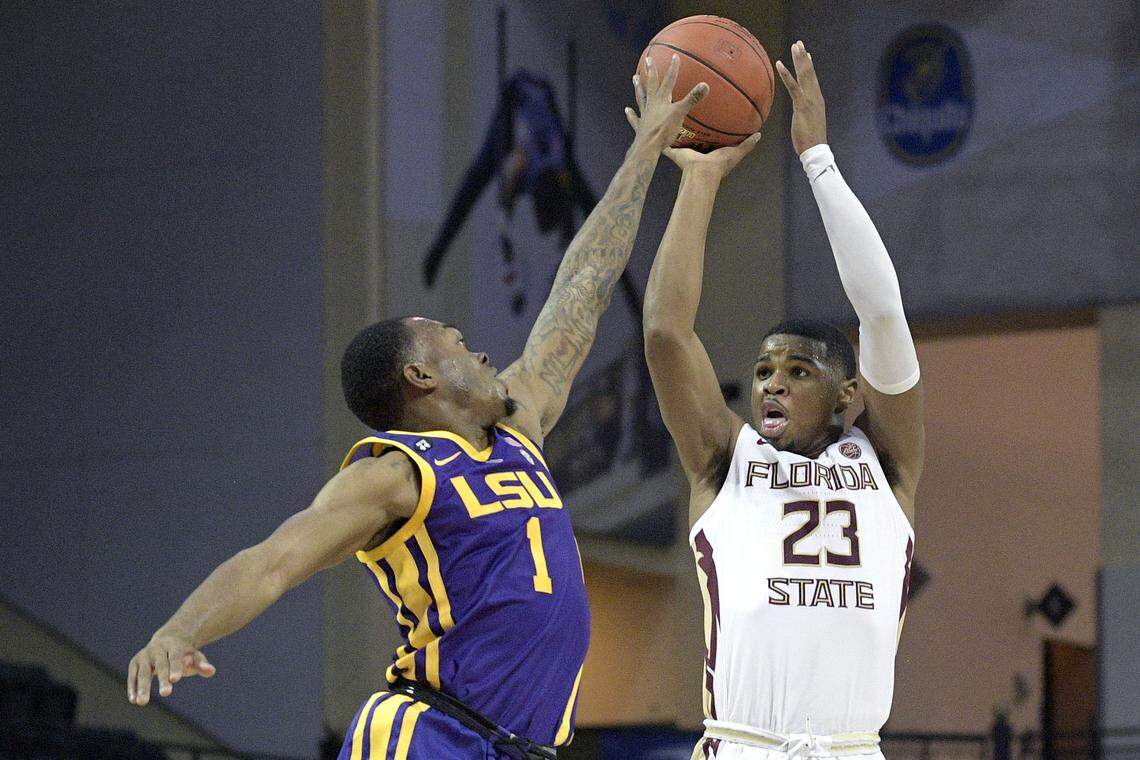 Florida State guard M.J. Walker (23) goes up to shoot in front of LSU guard Ja’vonte Smart (1) during the first half of an NCAA college basketball game Friday, Nov. 23, 2018, in Lake Buena Vista, Fla.