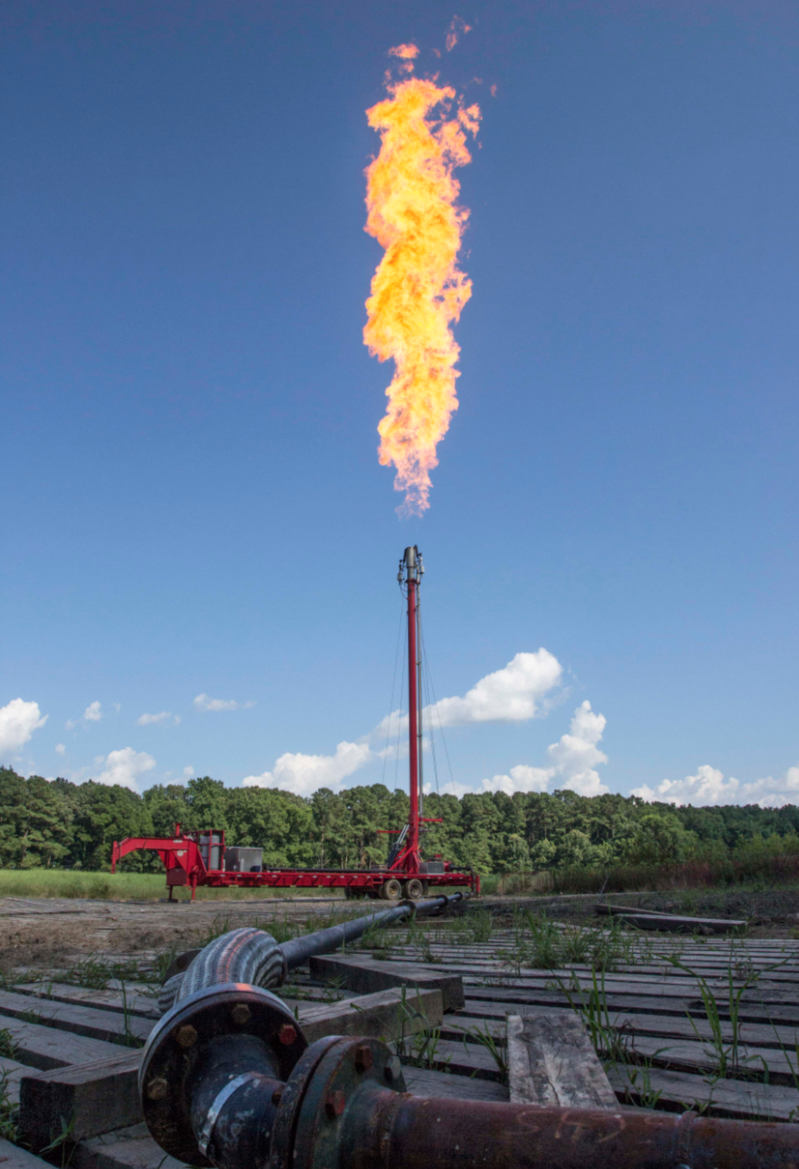 Natural gas is burned off through a tall vertical pipe called a flare stack as part of routine pipeline maintenance in a process called “flaring.”