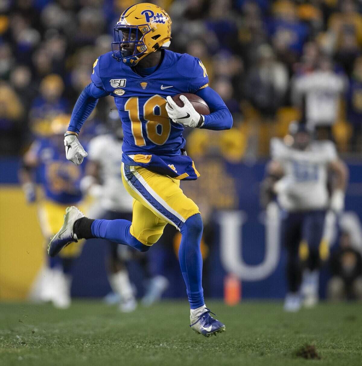 Pittsburgh’s Shocky Jacques-Louis (18) races untouched on a 74-yard pass completion from quarterback Kenny Pickett (8) to give Pitt a 17-7 lead over North Carolina in the second quarter on Thursday, November 14, 2019 at Heinz Field in Pittsburgh, Pa.