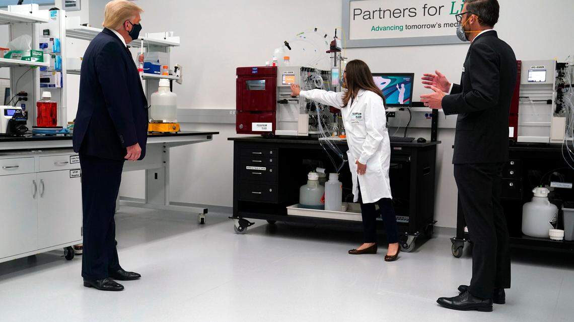 Fujifilm Diosynth Biotechnologies CEO Martin Meeson, right, speaks as President Donald Trump participates in a tour of Bioprocess Innovation Center at Fujifilm Diosynth Biotechnologies, Monday, July 27, 2020, in Morrisville, N.C.