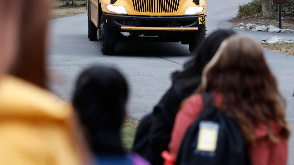 Students wait to board an approaching Wake County Schools bus earlier this year. Due to a driver shortage, Wake County will switch to an A/B schedule on 17 routes where middle school and high school students won’t get daily bus service.