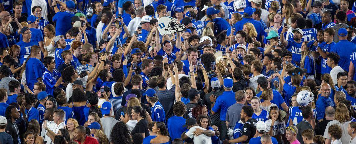 Duke fans storm the field to celebrate their 28-7 victory over Clemson on Monday, September 4, 2023 at Wallace Wade Stadium Stadium in Durham, N.C.