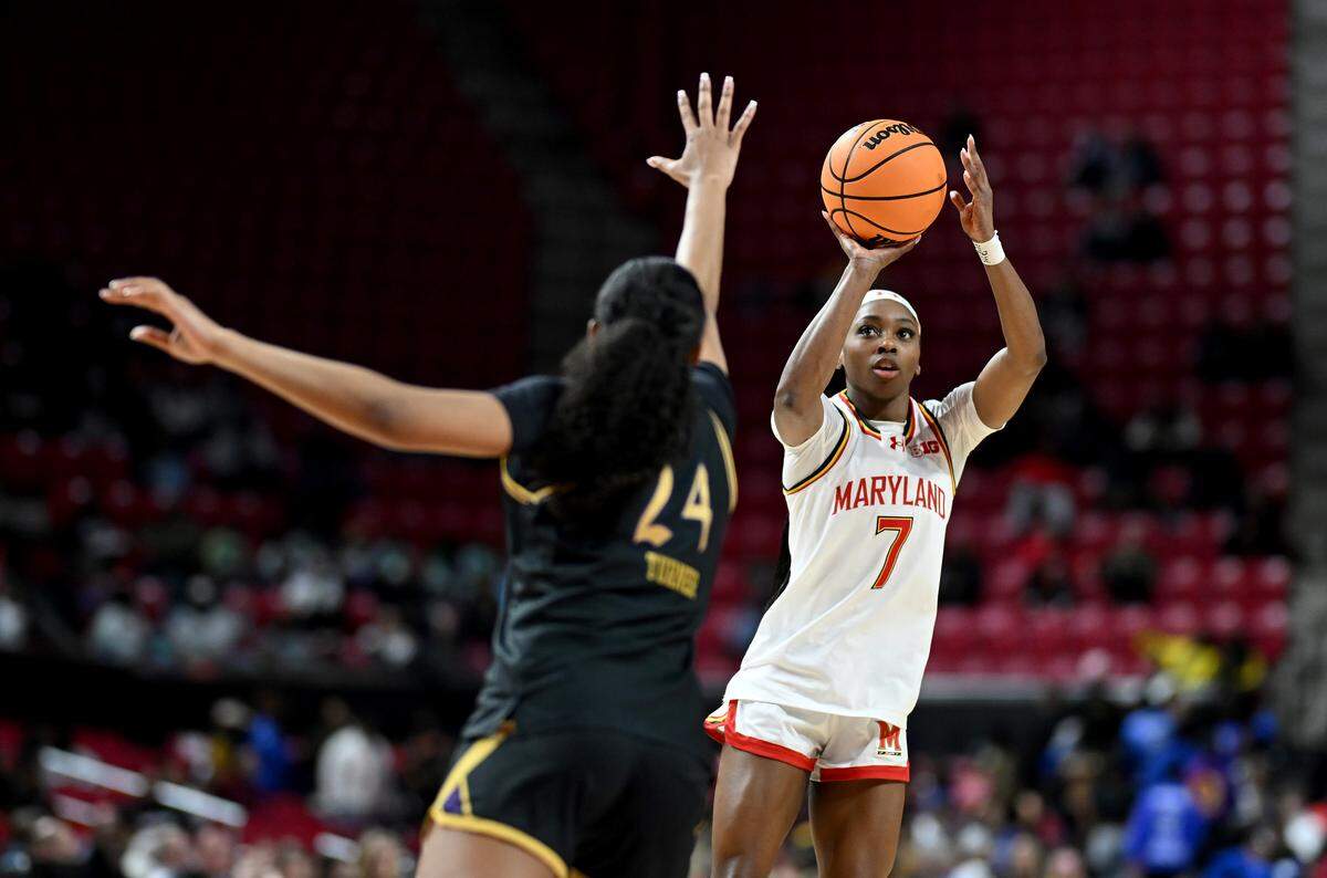 Oluchi Okananwa (7) of the Maryland Terrapins shoots the ball in the third quarter against Daija Turner of Northwestern at Xfinity Center on Feb. 25, 2026 in College Park, Maryland.