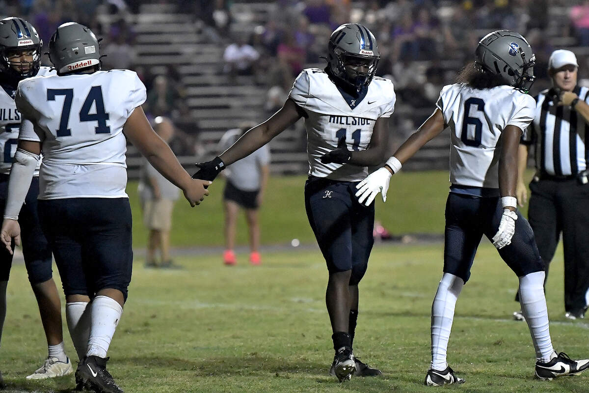 Hillside running back Ameil Braswell (11) celebrates his touchdown against Riverside with teammates during the first half. The Durham Hillside Hornets and the Durham-Riverside Pirates met in a football game in Durham. N.C. on October 4, 2024.