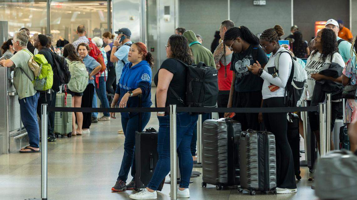 Passengers wait in Terminal 2 at RDU International Airport on Friday, July 19, 2024 after a worldwide computer outage traced to a software update by the cybersecurity company CrowdStrike caused numerous canceled and delayed flights. An unrelated malfunction occurred Sunday, Sept. 29, causing delays.