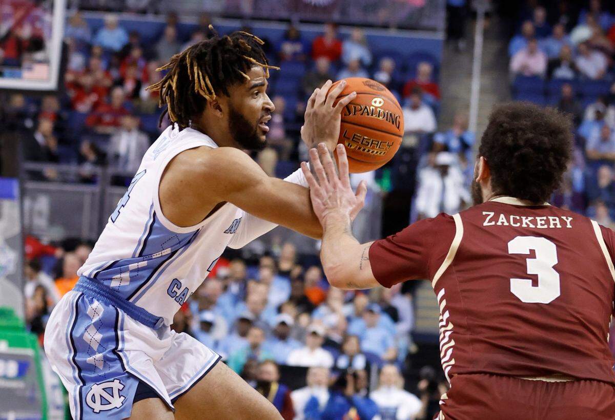 North Carolina’s R.J. Davis (4) looks to pass as he is pressured by Boston College’s Jaeden Zackery (3) during the first half of UNC’s game against Boston College in the second round of the New York Life ACC Men’s Basketball Tournament in Greensboro, N.C., Wednesday, March 8, 2023.