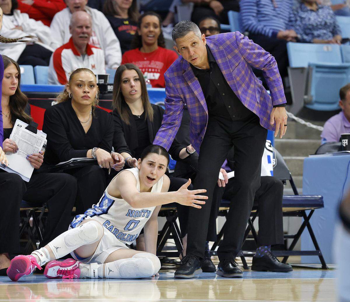 North Carolina’s Lanie Grant and Western Illinois head coach JD Gravina react after Grant fell out of bounds during the first half of the Tar Heels’ 82-51 first-round NCAA Tournament win on Friday, March 20, 2026, at Carmichael Arena in Chapel Hill, N.C.