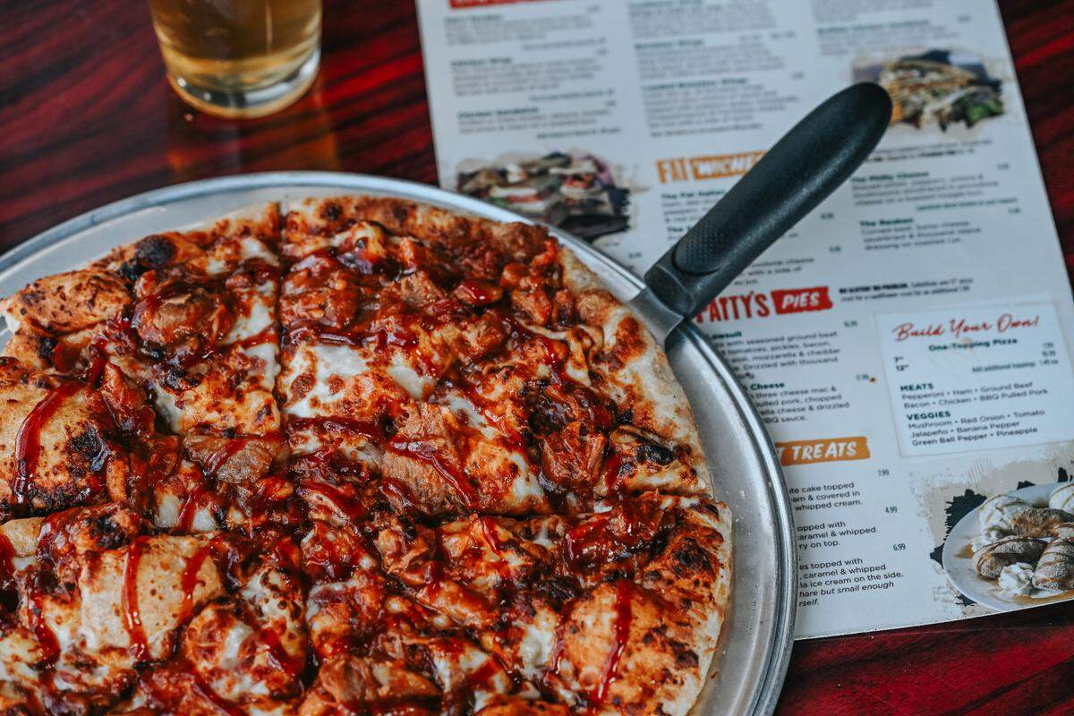 In addition to burgers, Fat Patty’s serves pizzas, sandwiches, salads, wings, quesadillas and nachos.