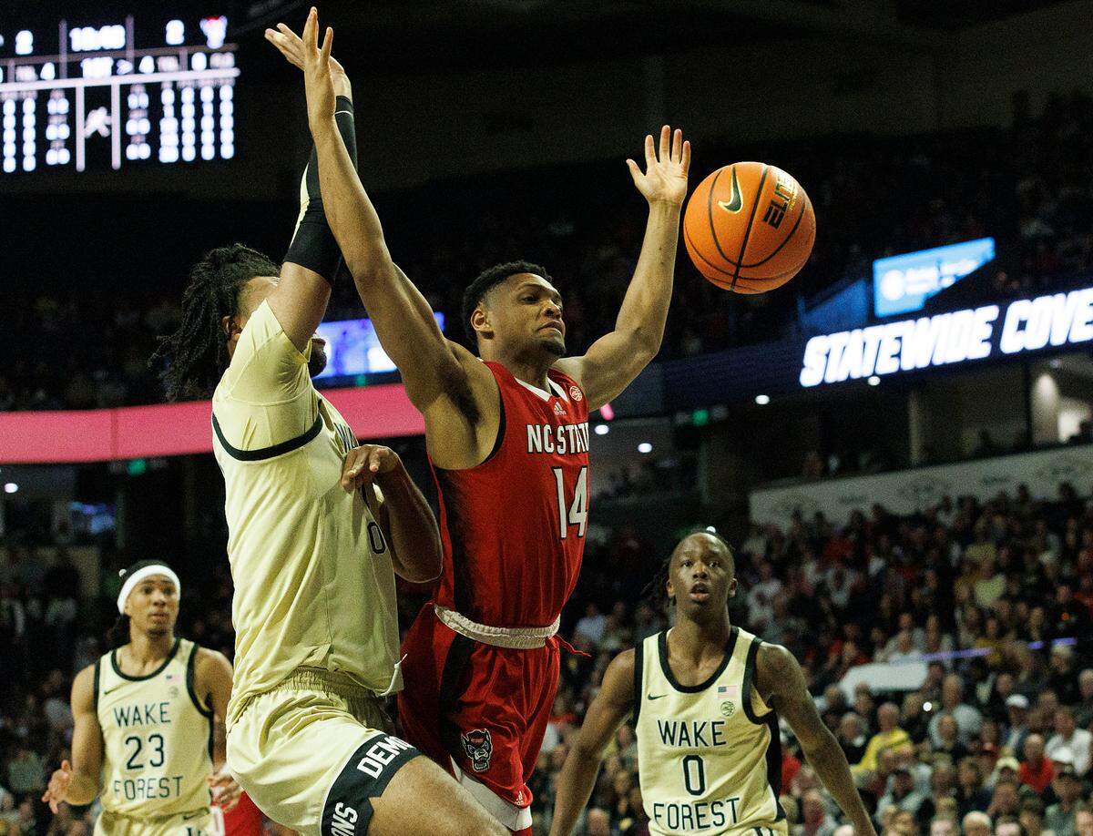 N.C. State’s Casey Morsell is fouled while driving to the basket during the first half of the Wolfpack’s game against Wake Forest on Saturday, Feb. 10, 2024, at Lawrence Joel Veterans Memorial Coliseum in Winston-Salem, N.C.