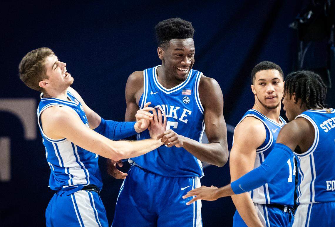 Duke center Mark Williams (15) is congratulated by his teammates after scoring a basket and drawing a foul on Wednesday, Feb. 17, 2021 in Winston-Salem, N.C.