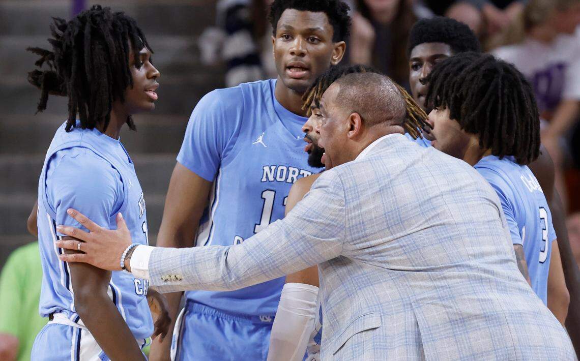 North Carolina head coach Hubert Davis talks with Ian Jackson (11) while in a huddle with Jalen Washington (13), RJ Davis (4), Elliot Cadeau (3) and Drake Powell (9) during the first half of UNC’s game against Clemson at  Littlejohn Coliseum in Clemson, S.C., Monday, Feb. 10, 2025.