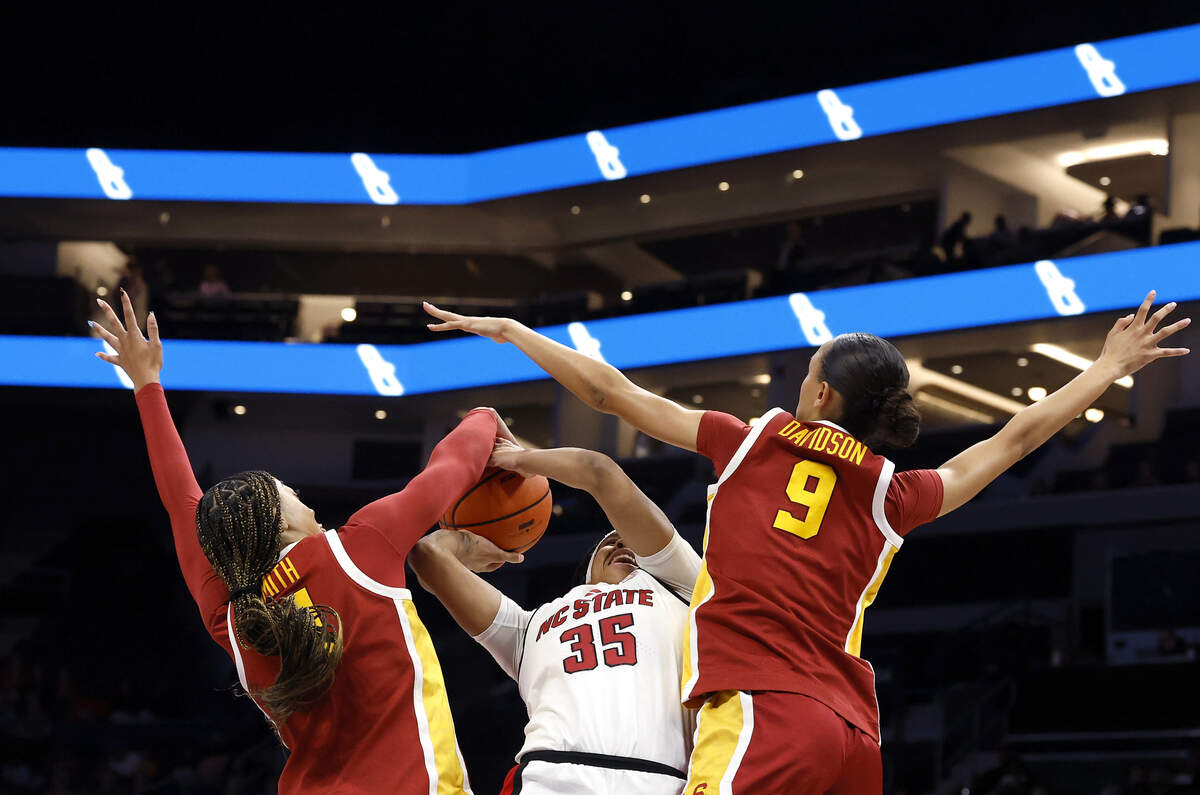 N.C. State’s Zoe Brooks looks to shoot over Southern California’s Kennedy Smith and Southern California’s Jazzy Davidson during the first half of the Wolfpack’s 69-68 loss in the Ally Tipoff game on Sunday, Nov. 9, 2025, at Spectrum Center in Charlotte, N.C.