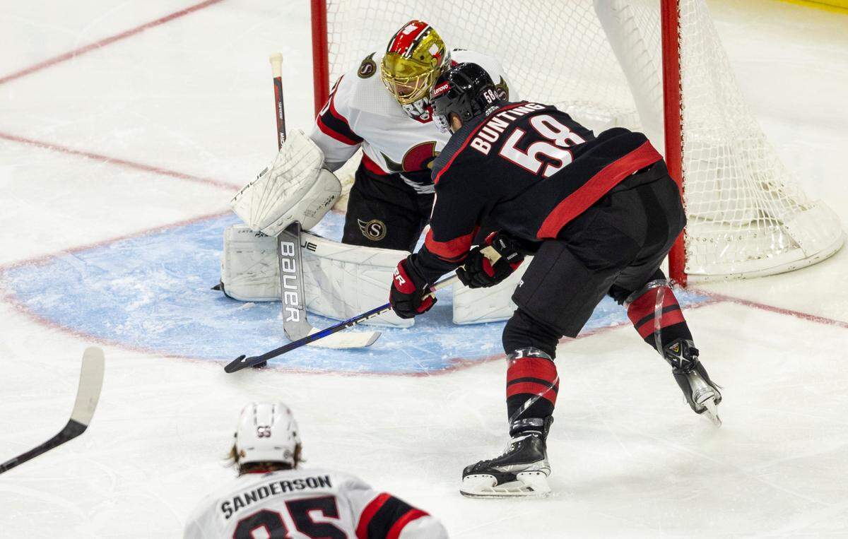 The Carolina Hurricanes Michael Bunting (58) scores on the Ottawa Senators goalie Joonas Korpisalo (70) in the second period on Wednesday, October 11, 2023 at PNC Arena, in Raleigh N.C.