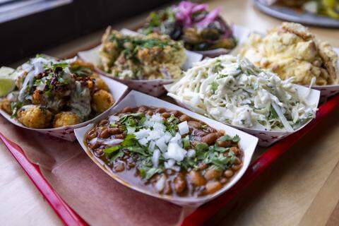 081225-LAWRENCE-BBQ-TEL-15.jpg Customers can order standard and premium sides by the half-pint or pint. They range from barbecue staples such as red and white slaw, ‘cue beans and mac and cheese to broccoli Caesar and cheesy tater tot casserole.